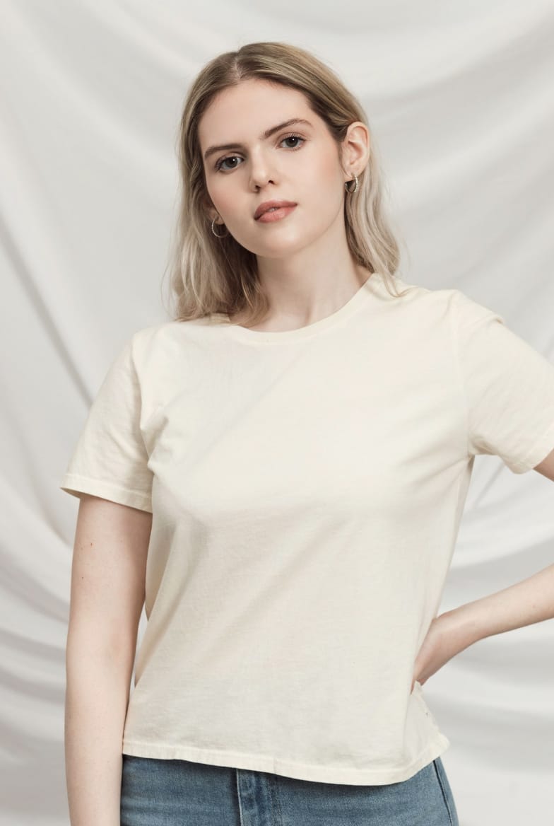 Model wearing women's black cotton crewneck tee.