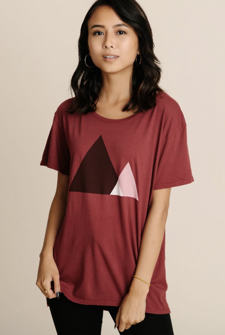 Model wearing women's black cotton crewneck tee.